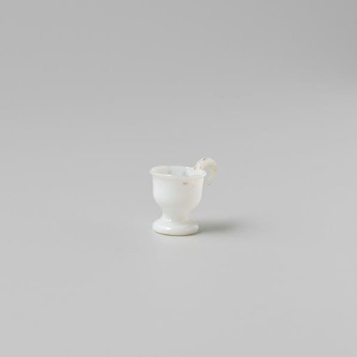 Cup with handle, painted with a flower in white, red and green