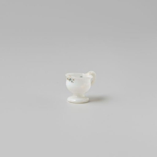 Cup with handle, painted with a flower in white, red and green