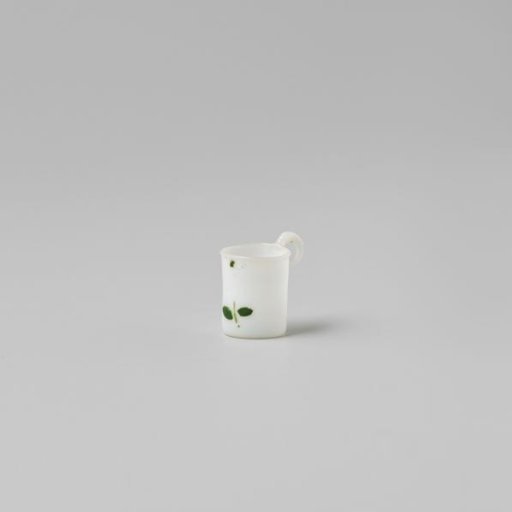 Cup with handle, painted with a flower in white, red and green