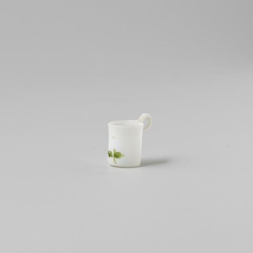 Cup with handle, painted with a flower in white, red and green