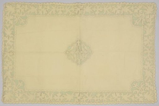 Flannel footstool with border and medallion in Richelieu embroidery