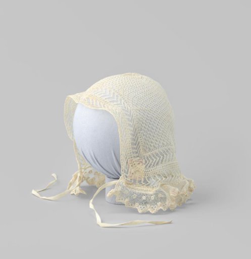 Children's cap in Frisian knitting, edged at the front with Brussels lace