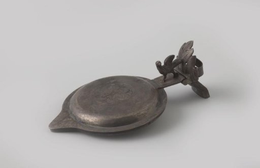 Silver lid belonging to a faience jug