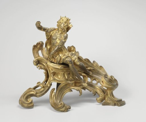 Fire dog of gilded bronze on a pedestal with leaf volutes, with a man in fluttering robes and a woman with a fragment of an instrument in her left hand, the trident is missing