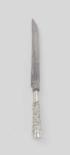 Knife with handle decorated with fine relief scrolls on a granulated ground