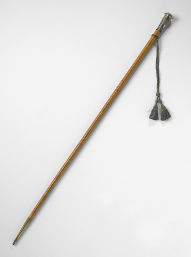 Walking stick of bamboo with twelve-sided silver knob depicting St. Christopher with Child Jesus on the arm