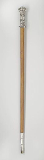 Cane of rattan with a chased silver knob and eye, fitted with a copper point
