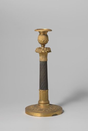 Candelabrum of partially gilded bronze, decorated with rosettes and topped with a basket of flowers and fruit