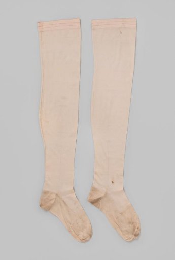 Knitted white silk stocking in tricot stitch, with three narrow pink stripes at the top and one embroidered floral decorative line at the bottom