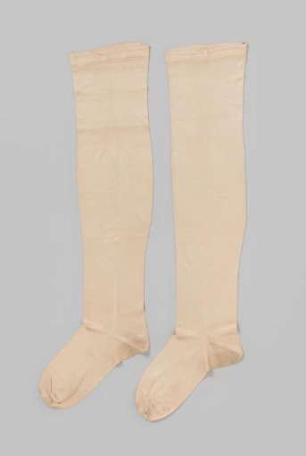 Knitted white silk stocking in tricot stitch, with two narrow pink stripes at the top and two embroidered decorative lines with geometric motif at the bottom