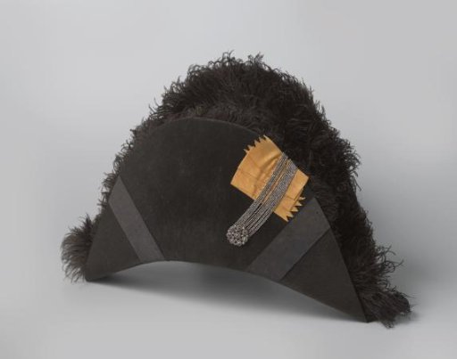 Black feather with ostrich plumes, two black moiré silk ribbons, and an ornament of steel beads, including an orange ribbon and a steel button
