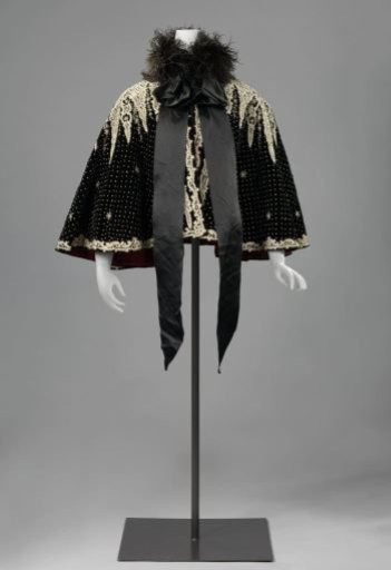 Cape with small knobs and rosettes