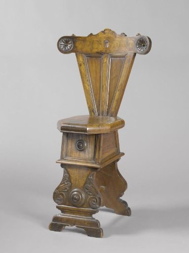 Walnut chair with octagonal seat. Shield with tree and decorations in intarsia