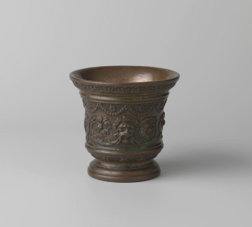 Mortar with masks, scrolling foliage, and pearl strings