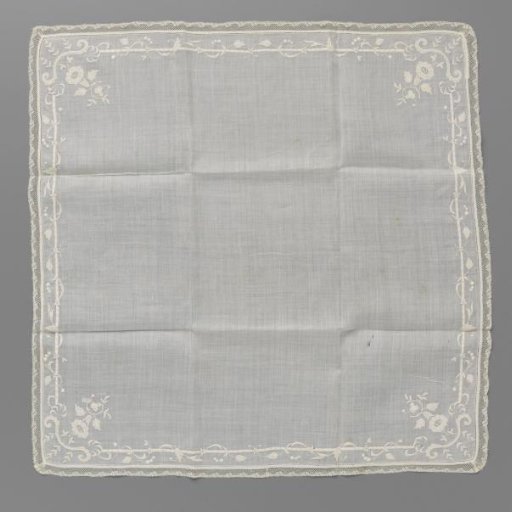 Handkerchief of batiste with a vine around a straight line and a flowering branch in the corners and edged with a border of Valenciennes lace