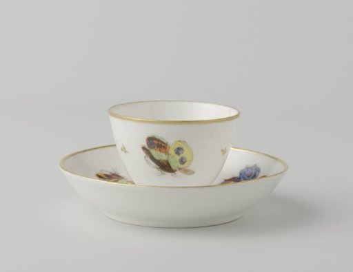 Cup and saucer painted with butterflies and dragonflies