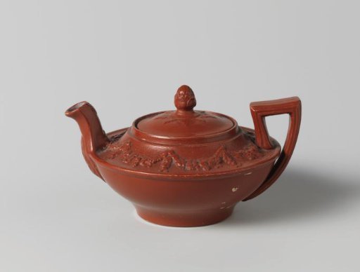 Teapot of red hard-baked earthenware, children's toy. With lid