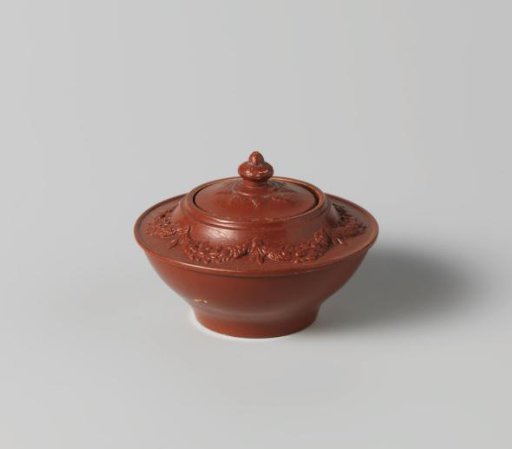 Lid of red stoneware, children's toy.