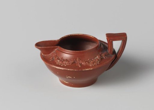 Milk jug of red earthenware, children's toy.