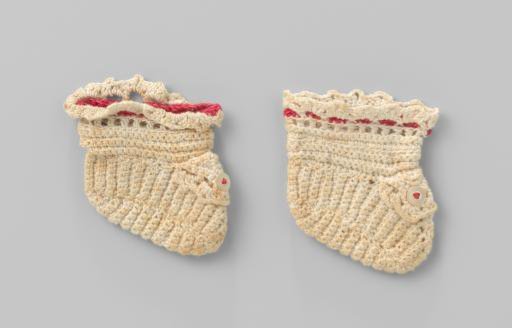 White knitted sock with red cord