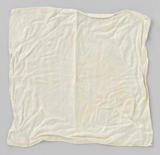 White linen napkin with woven geometric pattern