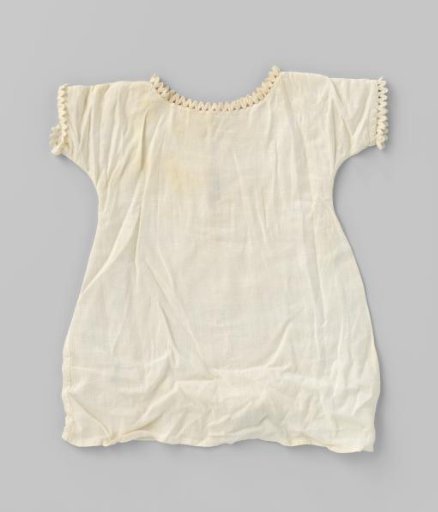 White nightgown for doll with zigzag trim on the sleeve and neck edges