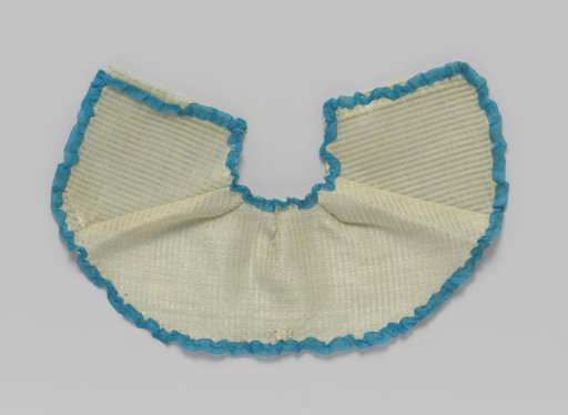 Cape of light green silk with blue binding