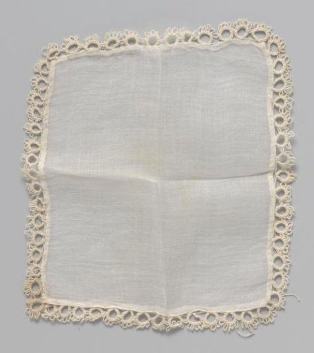 White cloth edged with lace border