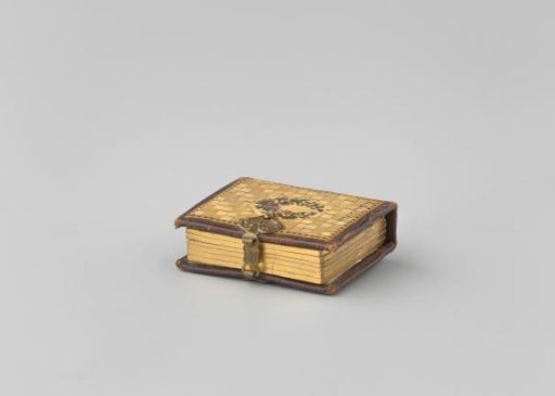 Book with lock; top and bottom covers of reed. Pages gilded on the edges. Inside photos and children's plates