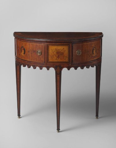 Half-moon table, decorated with marquetry, including a trophy with musical instruments
