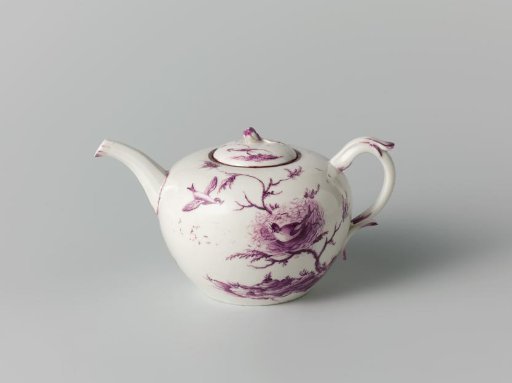 Teapot decorated with trees and birds