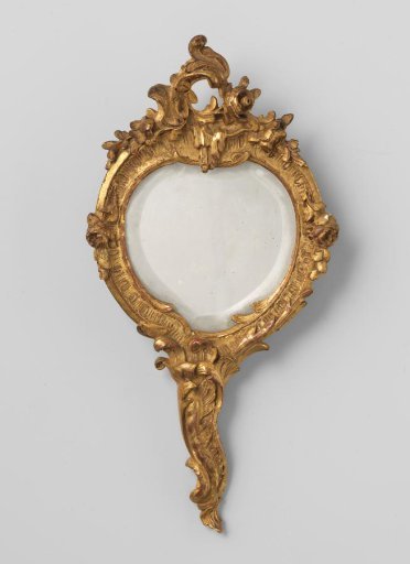 Hand mirror with handle, irregularly round in shape, with carving in C- and S-shapes and flowers and foliage, crowned by a C-shaped crest with stalactite and two roses.
