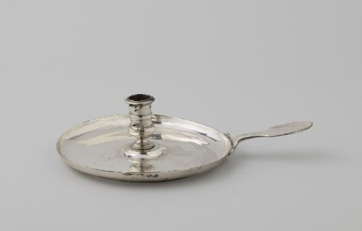 Silver Candle Warmer. On a round, unadorned leaf with a turned-up rim, a profiled candlestick. Scissors and dipper added later.