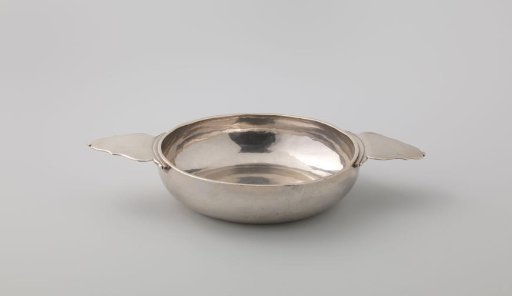 Brandy bowl of silver. Round with two broad, horizontal, unadorned ears.