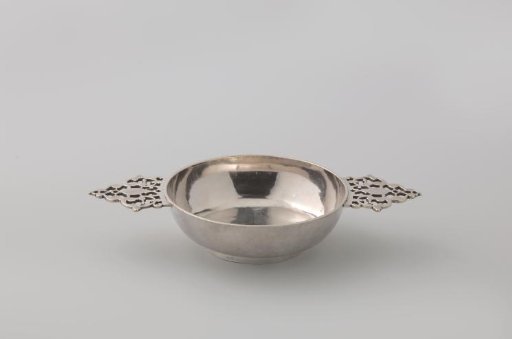 Silver brandy bowl on a low, round, unadorned bowl with two horizontal sawn handles. False.