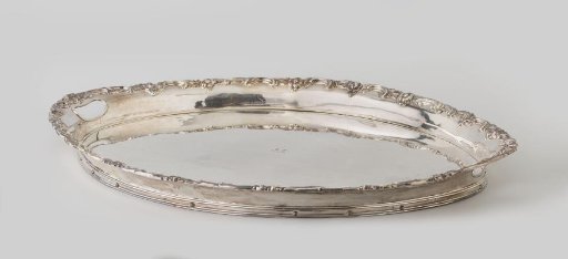Sheet, oval, with a border of C-scrolls and flowers