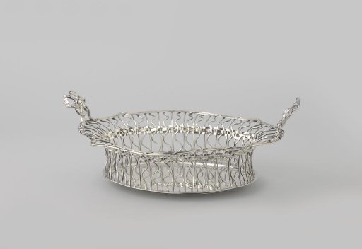 Bread basket, oval, with walls consisting of braided wirework and two loops as handles