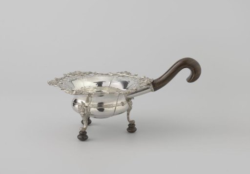 Pipe warmer, pierced at the top with floral scrolls