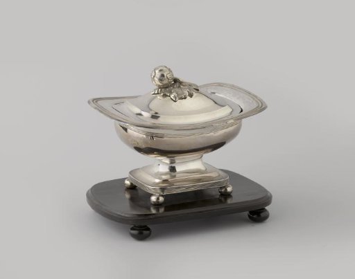 Tobacco pot with silver lid, on a high foot of ebony wood. Lid knob in the form of a fruit leaf.