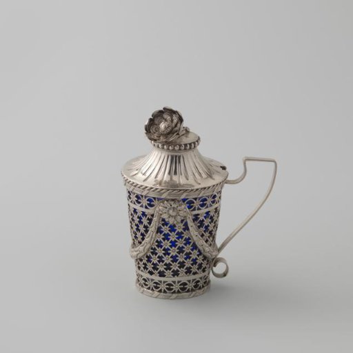 Silver mustard pot, round and tapering upwards with sawn lattice work with flower rosettes and applied garlands; inner bowl of blue glass