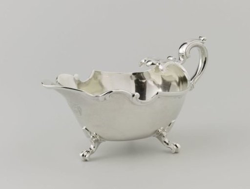 Shell-shaped sauce bowl on three curved legs