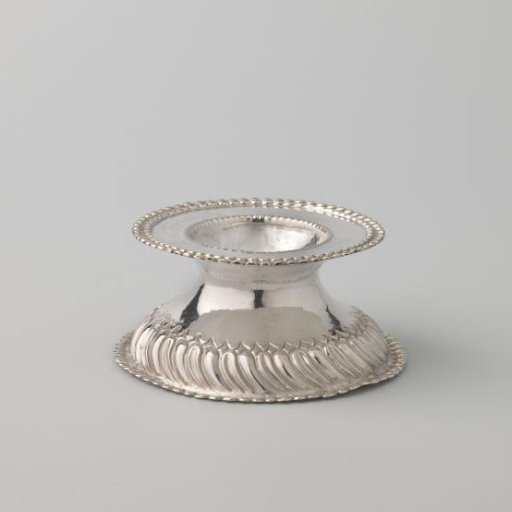 Salt cellar of silver, with a high-arched foot, surrounded by a wreath of knobs