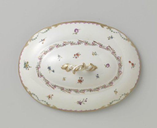 Lid with a knob, oval in shape, belonging to a service with a swirled ribbon motif featuring leafy branches, floral bouquets, and scattered flower branches