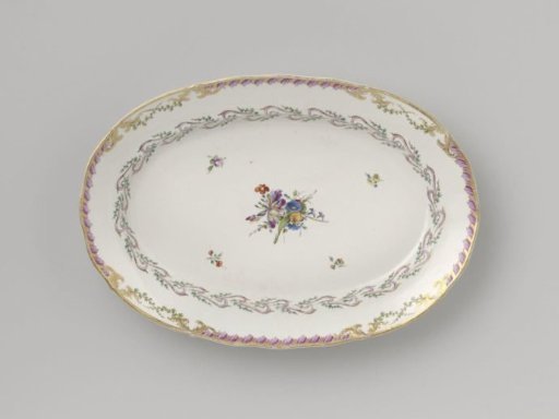 Dish, flat and oval in shape, belonging to a service with a swirled ribbon motif with leafy branches, flower bouquets and scattered flower sprays
