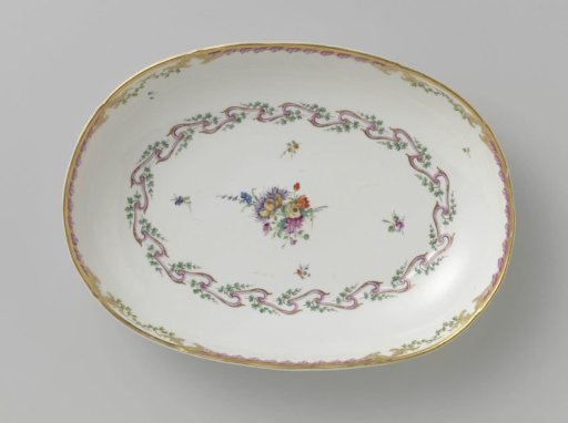 Bowl, deep and oval in shape, belonging to a service with a swirled ribbon motif with leafy branches, floral bouquets and scattered flower branches