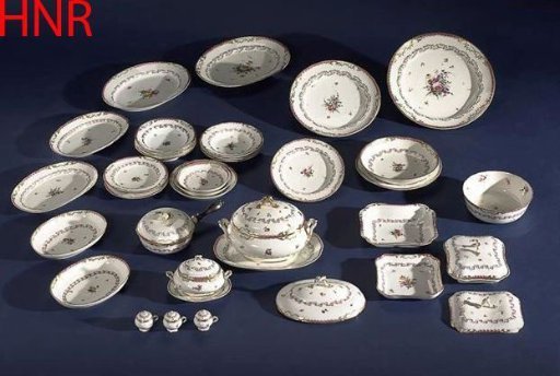 Plate, deep model, belonging to a service with a swirled ribbon motif featuring leafy branches, floral bouquets, and scattered flower sprigs