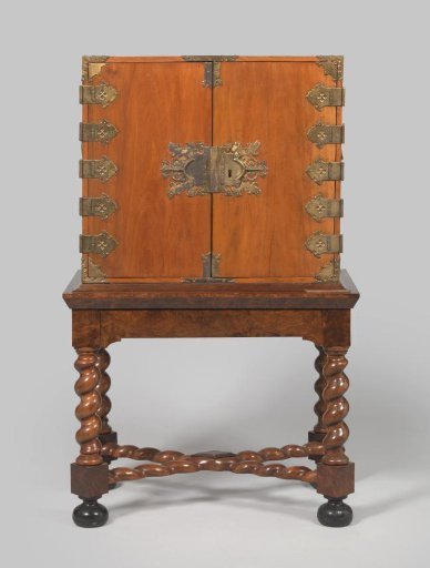 Cabinet of Indonesian wood on a stand
