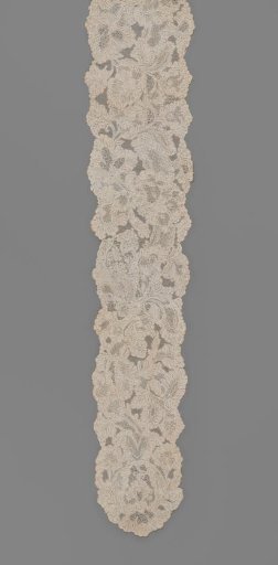Two sewn-together chin flaps of needle lace