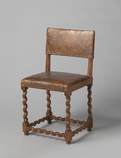 Walnut chair, upholstered in brown leather. Swung legs and stretchers.