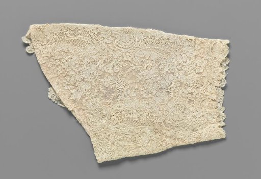 Sleeve made from a strip of needle lace with volutes and peonies